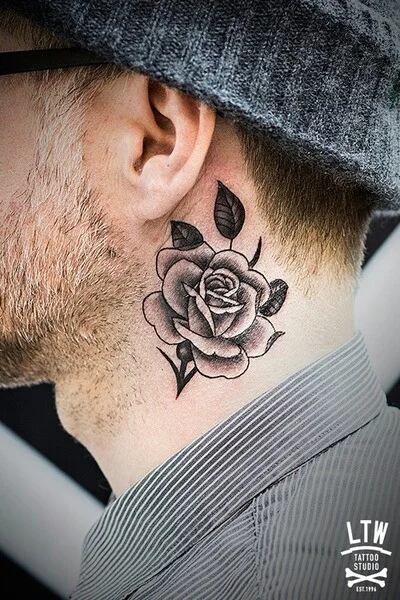 grey rose tattoo on man side neck