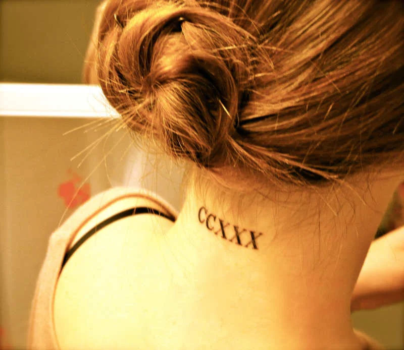 roman numerals tattoo on back of neck