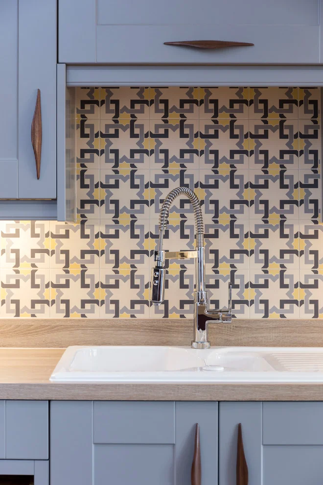 kitchen sink with background tiles