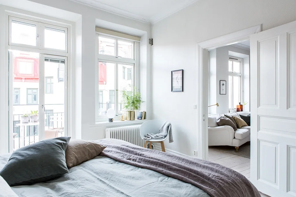 big glass door to balcony in bedroom