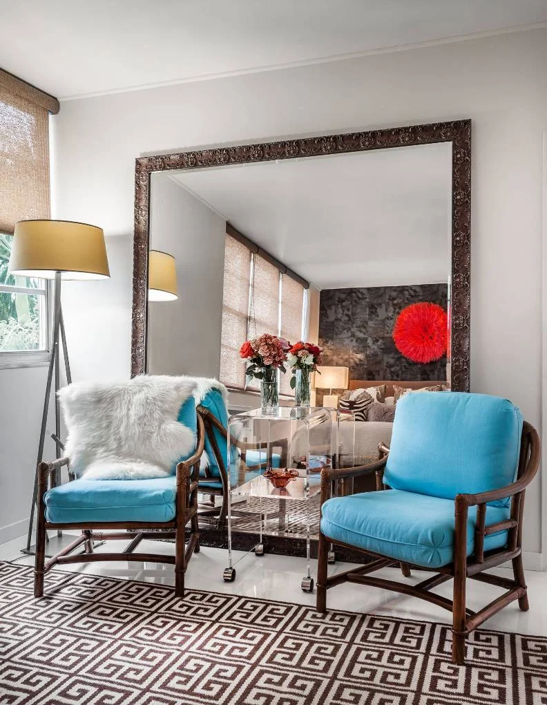 hanging leaning large mirror opposite window