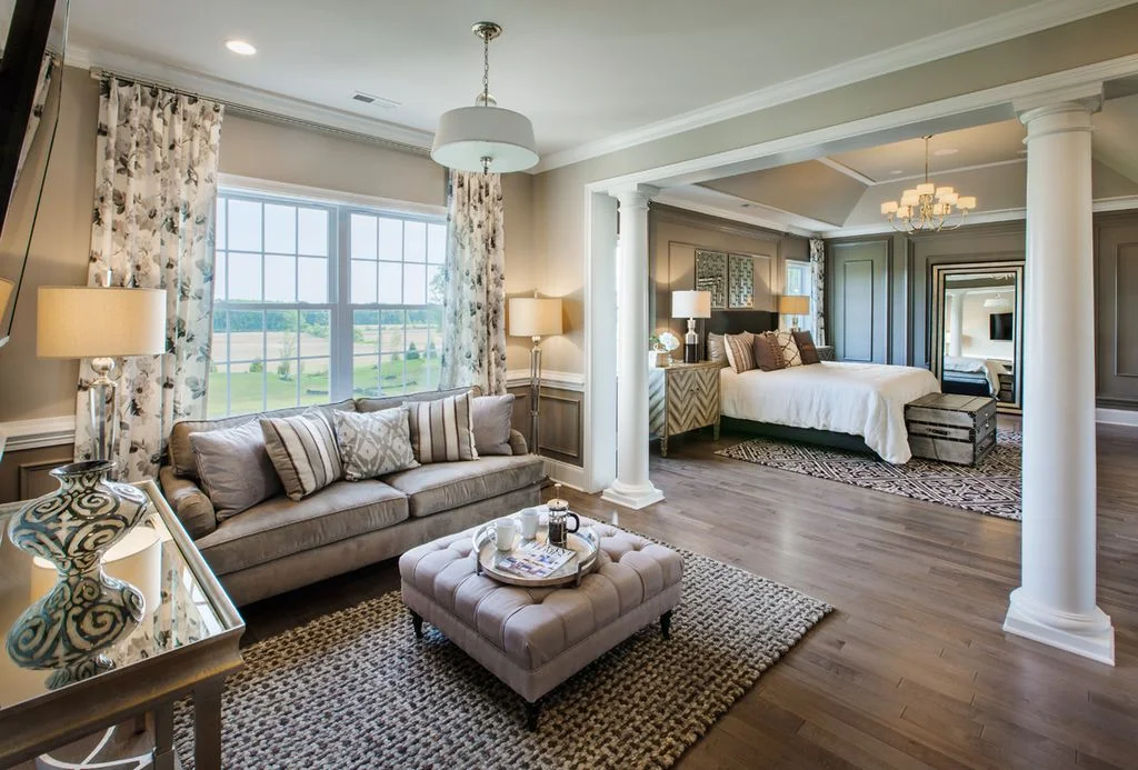 Bedroom with High Ceiling and Hardwood Floors