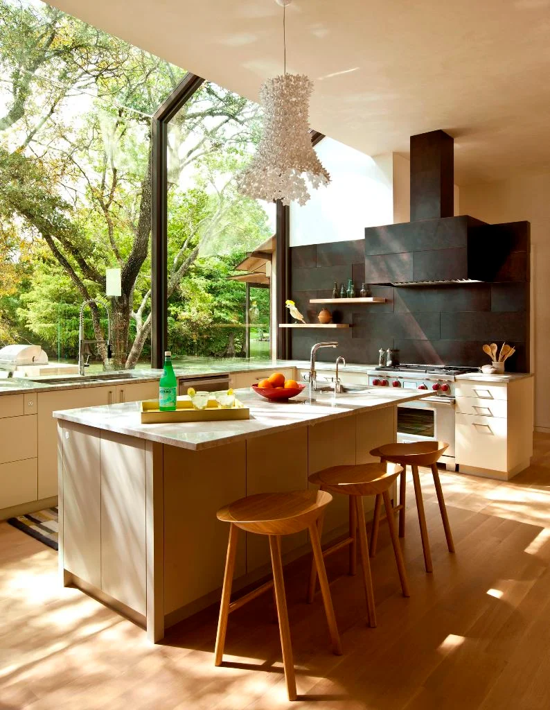 Beige Cabinets And Metal Backsplash