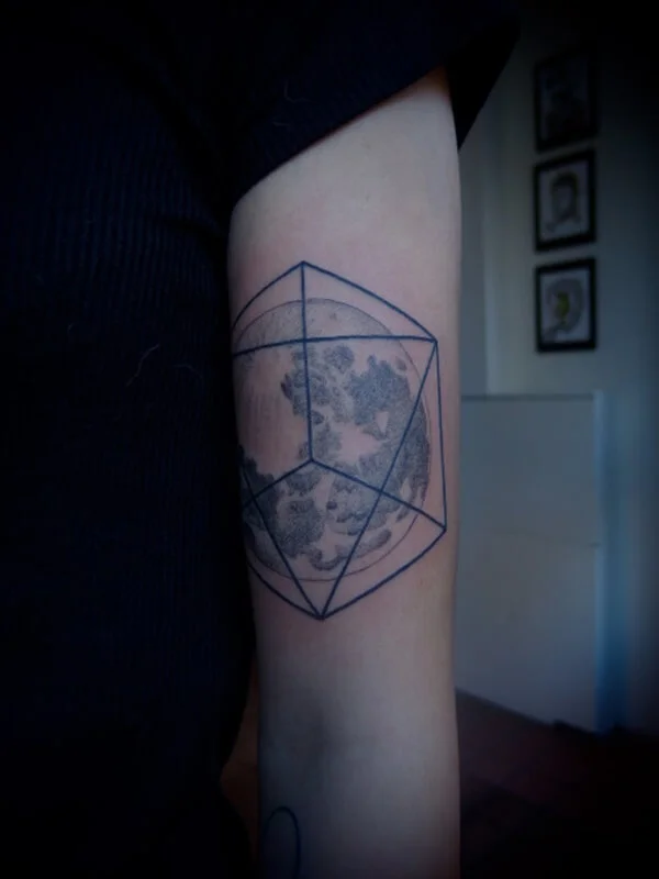 World Inside Geometric Shape Tattoo on Hand