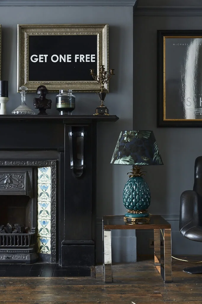 Reception room dark fireplace decor