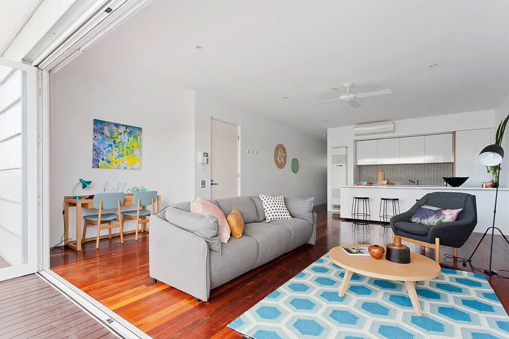blue rug wooden floor