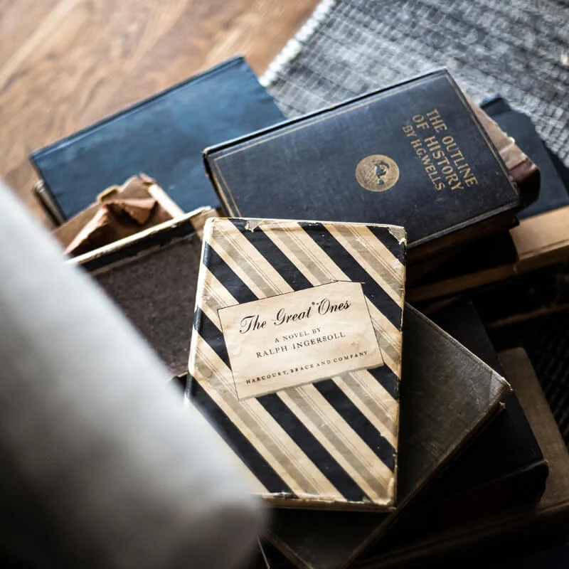 scattered books and textured rug