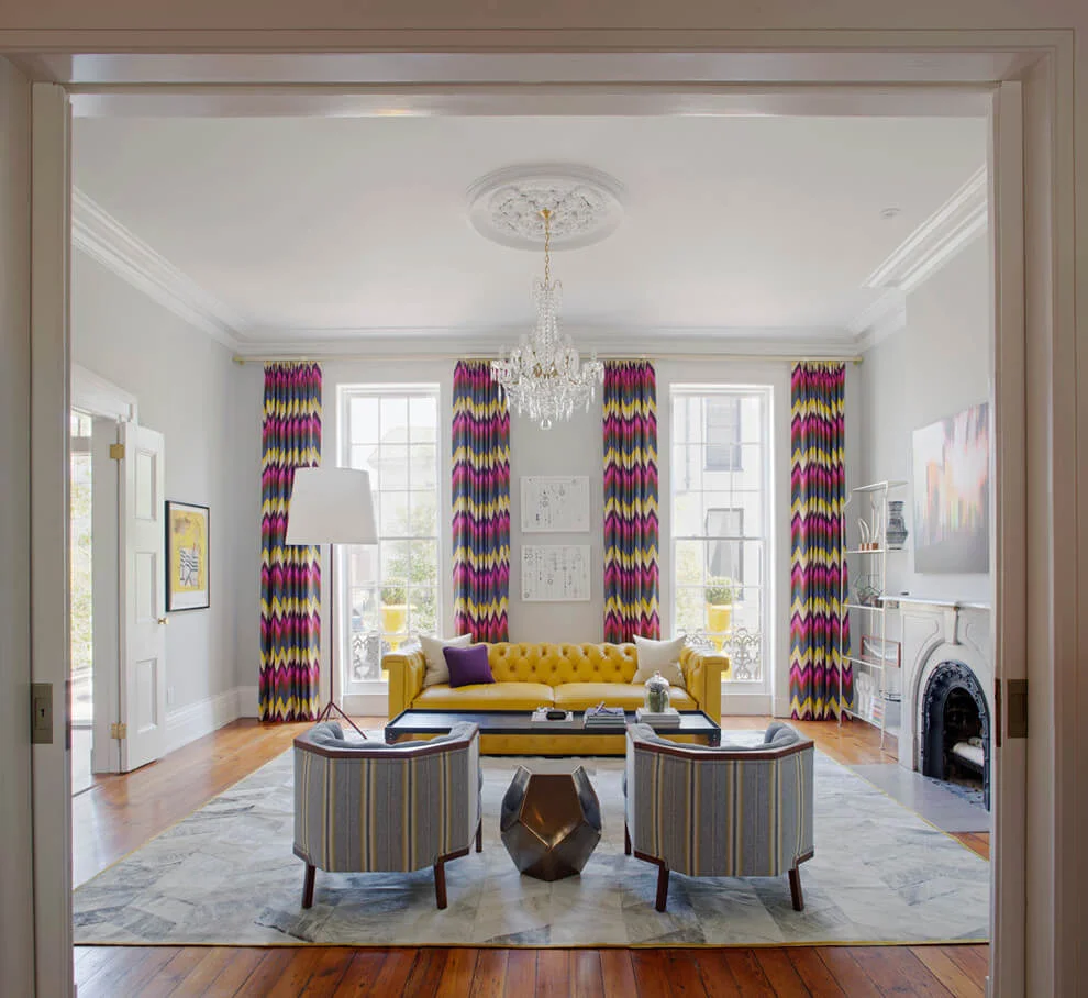 yellow sofa colorful curtains