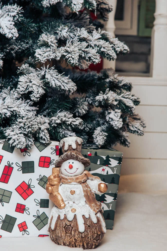 Snowman Under The Christmas Tree