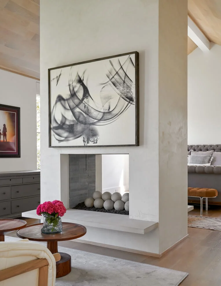 Two-sided Fireplace In Transitional Bedroom