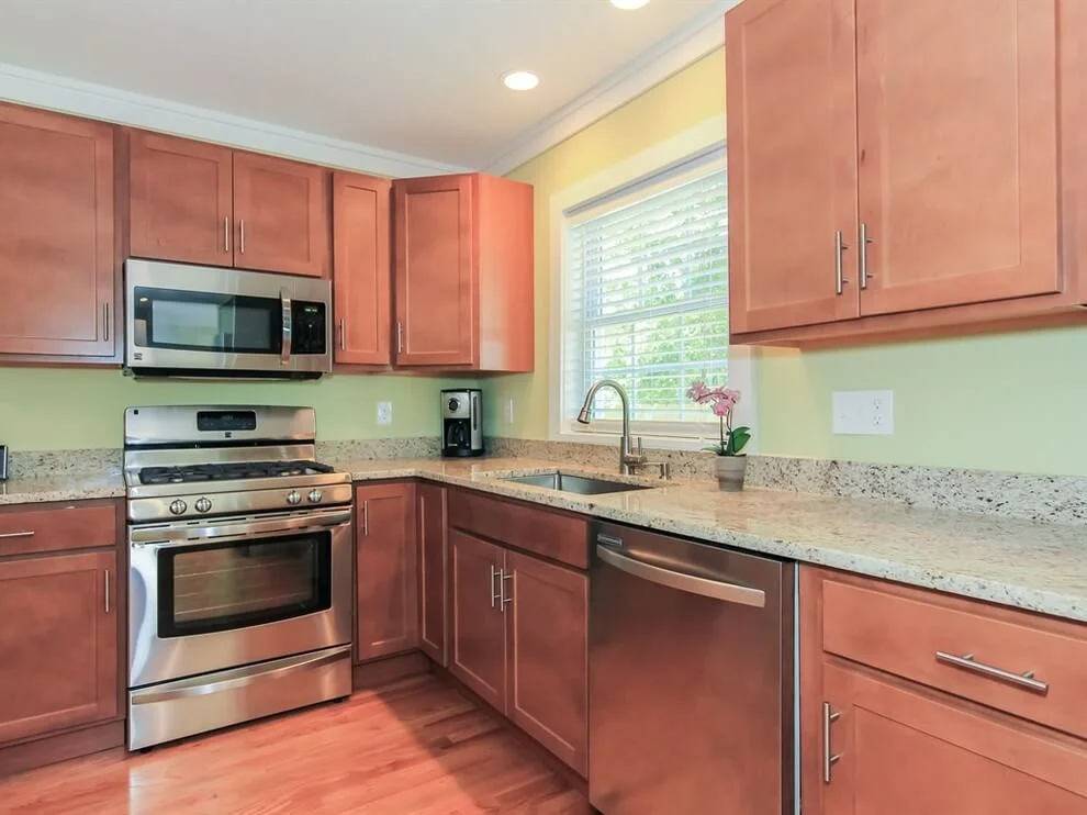Muted Red Tones In Cabinetry