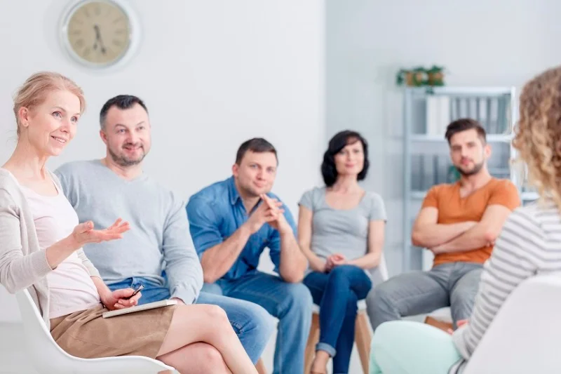 Therapist congratulating woman on progress