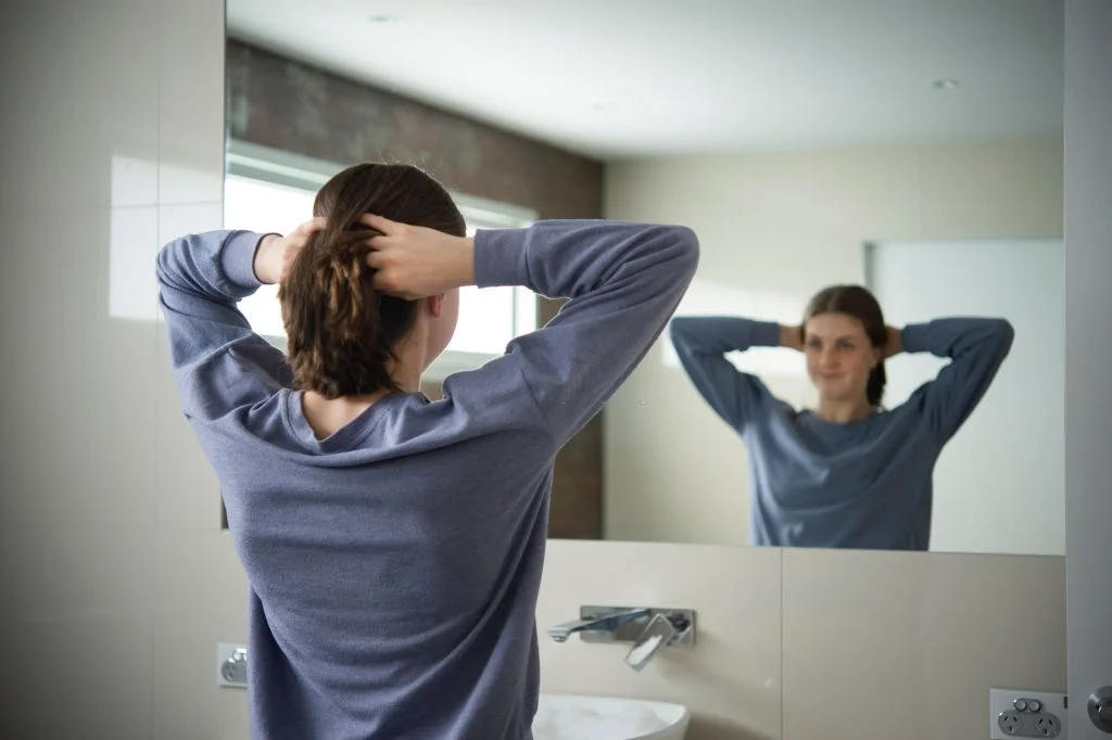 Young teenager enjoying her bathroom, copy space.