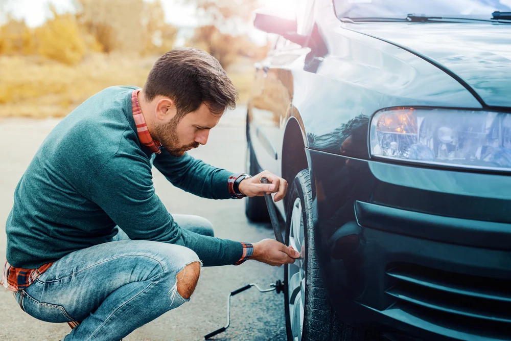 Man,Changing,Wheel,On,The,Car,At,The,Side,Of