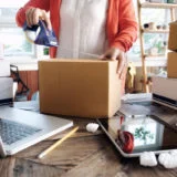 Young startup entrepreneur small business owner working at home, packaging and delivery situation.