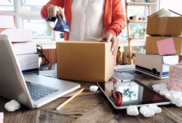 Young startup entrepreneur small business owner working at home, packaging and delivery situation.