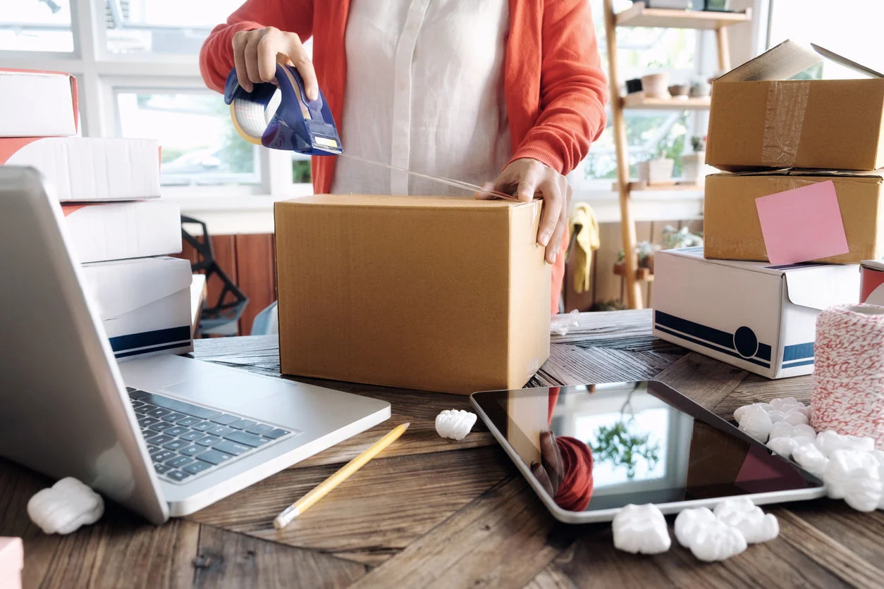 Young startup entrepreneur small business owner working at home, packaging and delivery situation.