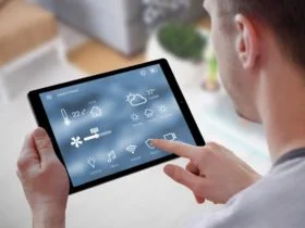 Smart home control on tablet. Interior of living room in the background.