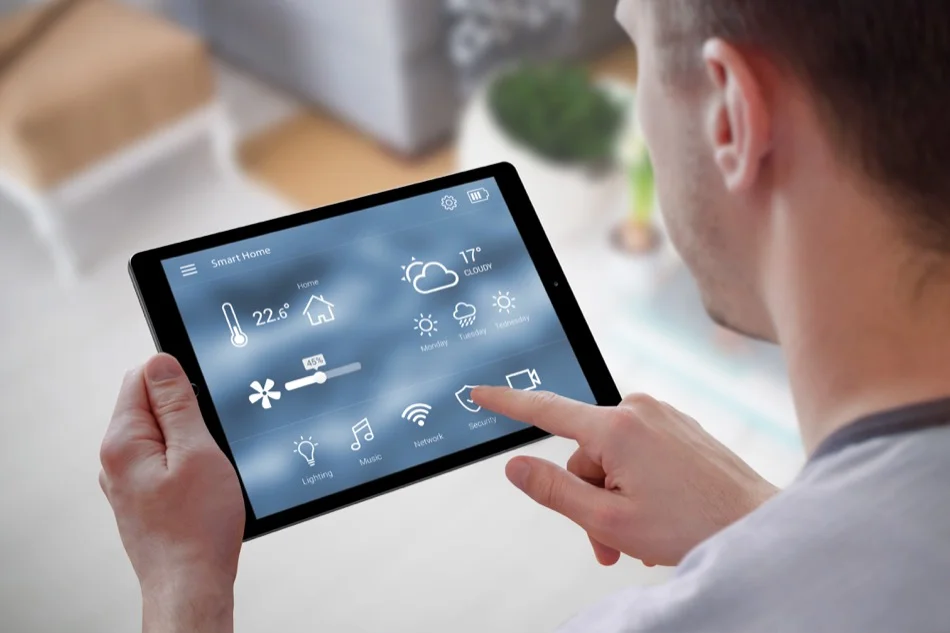 Smart home control on tablet. Interior of living room in the background.
